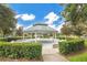 Community gazebo surrounded by lush landscaping and trees, perfect for relaxing at 12975 Calderdale Ave, Windermere, FL 34786