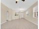 Open living area with tile flooring, archway, and large windows allowing for natural light at 12975 Calderdale Ave, Windermere, FL 34786