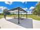 Community picnic area with tables and grills, perfect for a barbecue at 12975 Calderdale Ave, Windermere, FL 34786