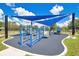 Community playground with blue awning, perfect for children at 12975 Calderdale Ave, Windermere, FL 34786