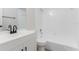 Bright bathroom with a white vanity, modern black faucet, and a shower and tub combination at 1327 Glenview Ln, Lakeland, FL 33813