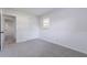 Bedroom with carpet, base molding, a double-door closet, and a window that provides natural light at 1327 Glenview Ln, Lakeland, FL 33813