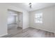 Inviting living room with stylish lighting, neutral walls, and modern floors. Doorways lead to other rooms at 1327 Glenview Ln, Lakeland, FL 33813