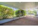 Enclosed patio with a textured floor that overlooks a garden area and provides natural light at 1327 Glenview Ln, Lakeland, FL 33813