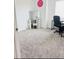Bright bedroom with a vanity, desk, carpet flooring, and a well-lit workspace at 2847 Big Sur Rd, Davenport, FL 33837