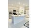 Modern kitchen featuring stainless steel appliances, gray cabinetry, and a large kitchen island at 2847 Big Sur Rd, Davenport, FL 33837