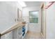 Bright bathroom featuring a vessel sink, tiled floors, and a glass-enclosed shower, offering a clean and modern design at 1910 Sylvester Ct, Lakeland, FL 33803