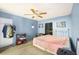 Cozy bedroom featuring a ceiling fan, ample space, and natural light, ideal for relaxation and rest at 1910 Sylvester Ct, Lakeland, FL 33803