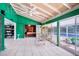 Open living space with a view of the pool, featuring tile floors and natural light at 1910 Sylvester Ct, Lakeland, FL 33803