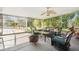 Enclosed patio with outdoor seating and fire pit, ideal for entertaining and relaxation with views of the yard at 1910 Sylvester Ct, Lakeland, FL 33803