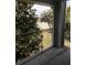 Balcony overlooking a scenic lake view surrounded by trees and foliage at 709 Secret Harbor Ln # 313, Lake Mary, FL 32746