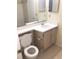 Bathroom featuring a single sink vanity, mirror, and toilet at 709 Secret Harbor Ln # 313, Lake Mary, FL 32746