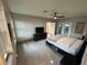 Large bedroom featuring a ceiling fan, tile floors, and a contemporary paint scheme at 808 Edgewater Dr, Orlando, FL 32804