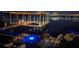 Nighttime view of dock, illuminated by underwater lighting and architectural accent lights at 808 Edgewater Dr, Orlando, FL 32804