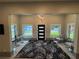 Elegant entryway with a modern black front door, unique lighting fixture, and lake views at 808 Edgewater Dr, Orlando, FL 32804