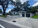 Charming exterior with a detached garage, modern accents, and a well-kept lawn at 808 Edgewater Dr, Orlando, FL 32804