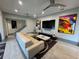 Stylish living room featuring modern decor, a large gray sectional sofa, and contemporary artwork at 808 Edgewater Dr, Orlando, FL 32804
