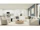Open-concept living room with a modern kitchen and stylish furniture for relaxed, comfortable living at 1097 Hour Glass Rd, Lakeland, FL 33801