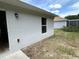 Exterior view of the backyard with a window at 1737 N Lakewood Ave, Ocoee, FL 34761