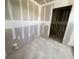 An incomplete bathroom showcases rough plumbing, prepped walls and an open doorway to a closet at 2359 Zuni Road, St Cloud, FL 34771