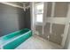 Bathroom with a partially installed green tub ready for finishing touches at 2359 Zuni Road, St Cloud, FL 34771