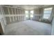 A future bedroom with three windows awaits flooring and paint to complete its design at 2359 Zuni Road, St Cloud, FL 34771
