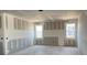 New construction with drywall. Two large windows light the interior of the unfinished living space at 2359 Zuni Road, St Cloud, FL 34771