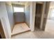 A corner shower in progress with orange pan awaits tiling and fixtures for a modern design at 2359 Zuni Road, St Cloud, FL 34771