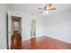 Spacious bedroom featuring hardwood floors and access to both a bathroom and closets at 609 Casa Park N Ct, Winter Springs, FL 32708