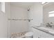 Modern bathroom featuring a shower with white tile, and granite vanity at 5008 Vanguard St, Orlando, FL 32819