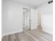 Clean bedroom features mirrored closet doors and light gray wood flooring at 5008 Vanguard St, Orlando, FL 32819