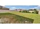Large backyard featuring a full fence, spacious grassy area, and privacy landscaping at 623 Grove St, Winter Haven, FL 33881
