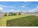 The expansive backyard is enclosed by a full privacy fence and has a large grassy area at 623 Grove St, Winter Haven, FL 33881