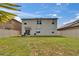 Spacious backyard featuring a well-maintained lawn and full fence for added privacy at 623 Grove St, Winter Haven, FL 33881