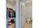 Bathroom with a toilet and an adjacent walk-in closet at 623 Grove St, Winter Haven, FL 33881
