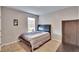 Neutral bedroom features carpet, bed, desk, and window at 623 Grove St, Winter Haven, FL 33881