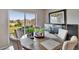 Bright dining area with sliding glass doors leading to the backyard and a view of the neighborhood at 623 Grove St, Winter Haven, FL 33881