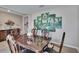 Elegant dining room with dark wood table, decorative artwork and a classic, neutral color scheme at 623 Grove St, Winter Haven, FL 33881