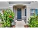 Close-up of a welcoming front door framed by lush greenery and an inviting entryway at 623 Grove St, Winter Haven, FL 33881