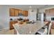 Updated kitchen featuring granite countertops, a kitchen island with seating, stainless steel appliances, and ample cabinet space at 623 Grove St, Winter Haven, FL 33881
