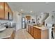 Modern kitchen showcases granite countertops, stainless steel appliances, spacious island, and open layout to the living area at 623 Grove St, Winter Haven, FL 33881