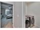 Hallway view of laundry room including newer Samsung washer and dryer at 623 Grove St, Winter Haven, FL 33881