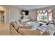 Relaxing living room featuring a large sectional sofa and ample natural light at 623 Grove St, Winter Haven, FL 33881