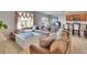 Cozy living room with a comfortable sofa, large windows, and an open floor plan at 623 Grove St, Winter Haven, FL 33881