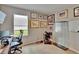 Well-lit office space with a desk, chair, and decorative artwork on the walls at 623 Grove St, Winter Haven, FL 33881