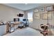 Functional office with multiple desks, natural light, and plenty of wall decor at 623 Grove St, Winter Haven, FL 33881