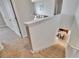Carpeted staircase overlooking the kitchen and lower level at 623 Grove St, Winter Haven, FL 33881