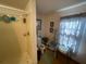 Bathroom featuring a shower stall, toilet, and medical equipment at 7175 Se 123Rd Pl, Belleview, FL 34420