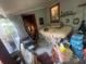 A bedroom or bonus room with natural light, tiled floors, and potential for versatile use at 7175 Se 123Rd Pl, Belleview, FL 34420