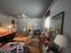Bedroom showcasing natural light, fan and comfortable sleeping arrangements at 7175 Se 123Rd Pl, Belleview, FL 34420